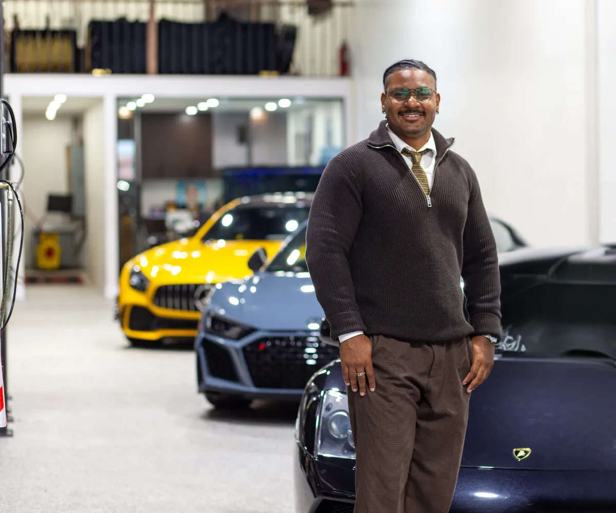 Jordan Russell, founder of Price Driven, standing in a showroom
