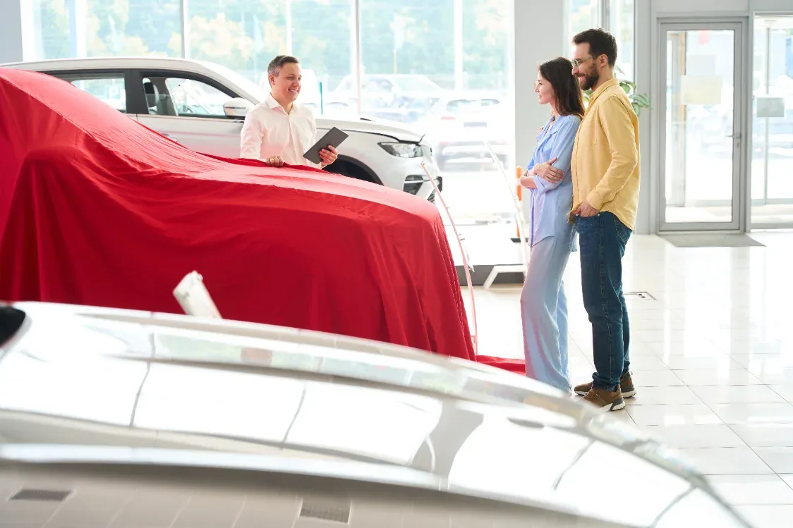 Broker on a call negotiating a new car deal with a dealer