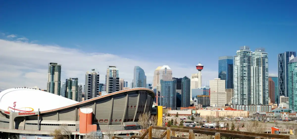 Calgary skyline and the Calgary Tower behind the Saddledome